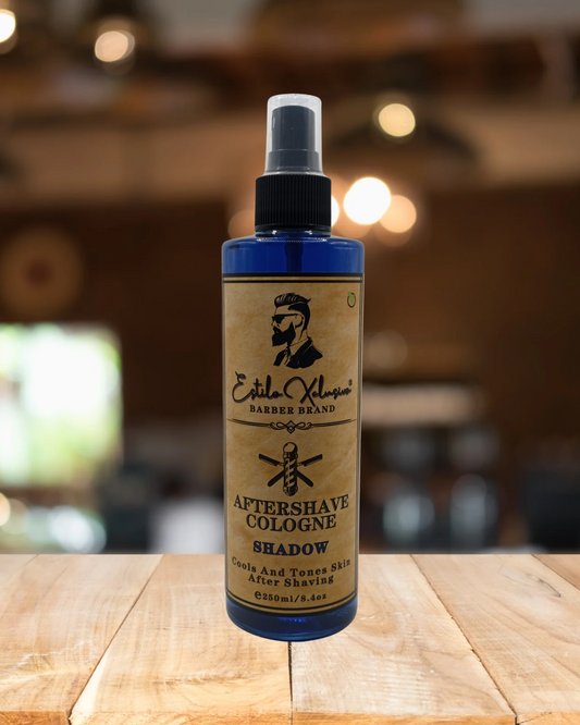 Aftershave cologne bottle on a wooden surface with a blurred background