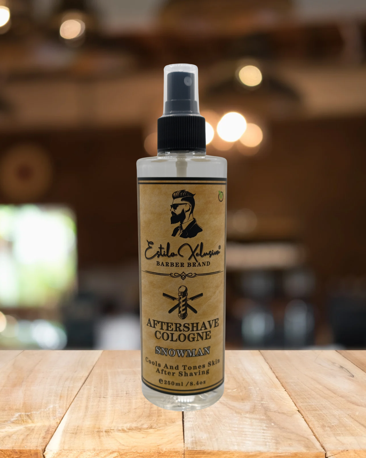 Bottle of aftershave cologne on a wooden surface with a blurred background