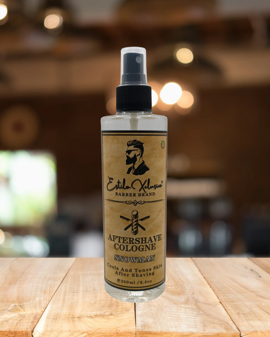 Bottle of aftershave cologne on a wooden surface with a blurred background